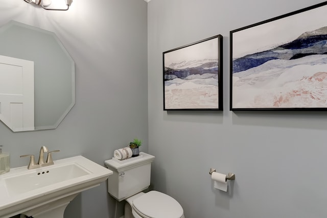 bathroom with a sink and toilet