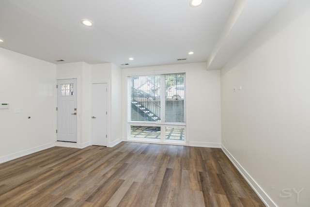 interior space with recessed lighting, visible vents, baseboards, and wood finished floors