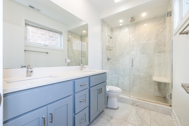 full bathroom featuring marble finish floor, a marble finish shower, and a sink