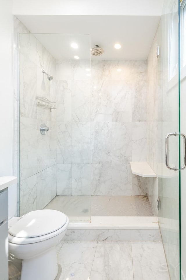 full bath featuring toilet, marble finish floor, a stall shower, recessed lighting, and vanity