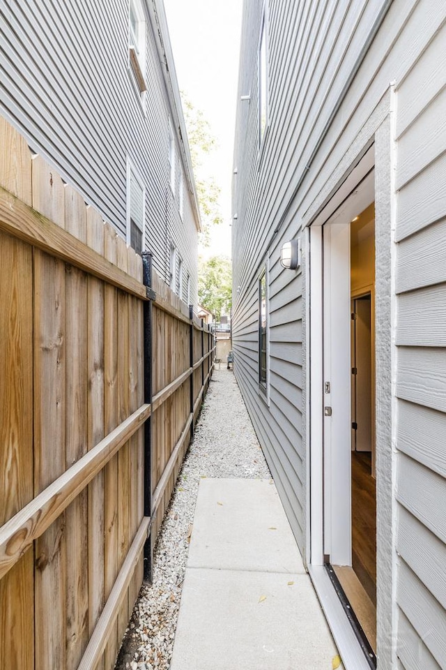 view of home's exterior featuring fence