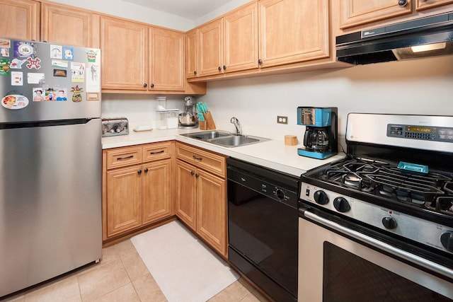 kitchen featuring under cabinet range hood, light countertops, light tile patterned floors, appliances with stainless steel finishes, and a sink