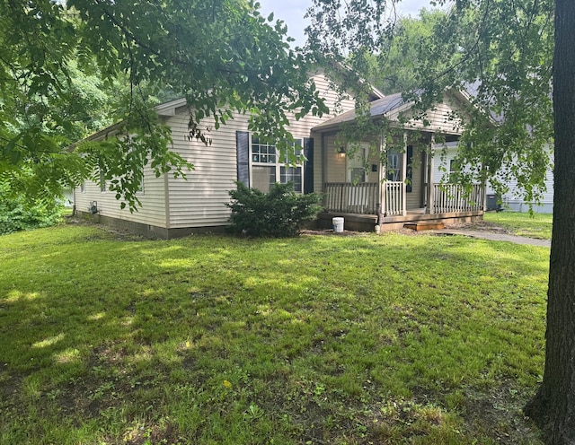 1312 N Hickory St, Champaign, IL 61820 - view of front of home featuring a front lawn and a porch
