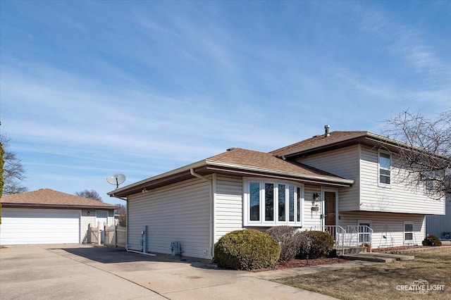 view of side of home featuring an outbuilding