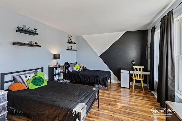 bedroom with wood finished floors