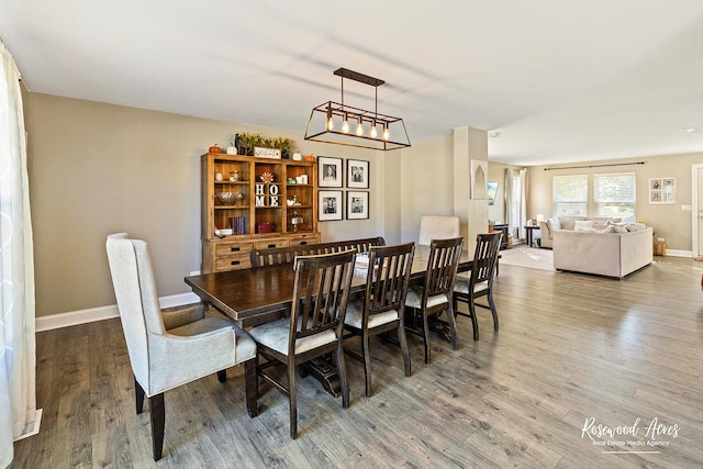 dining room with wood finished floors and baseboards