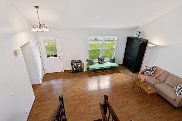 interior space with a wealth of natural light, lofted ceiling, and wood finished floors