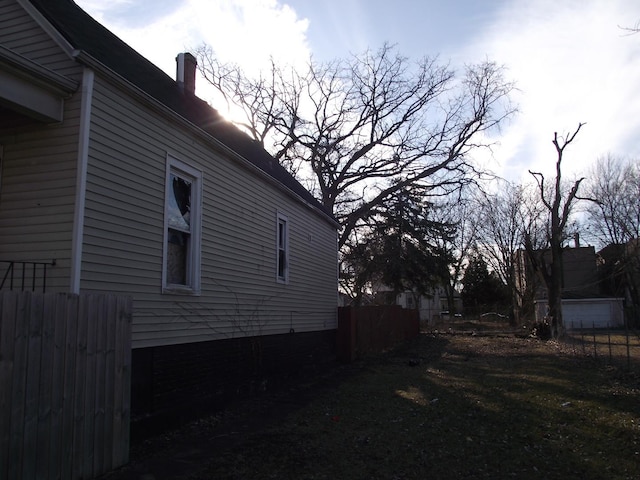 view of property exterior with fence