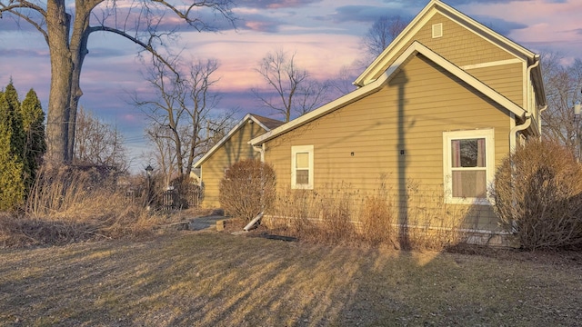 view of property exterior at dusk