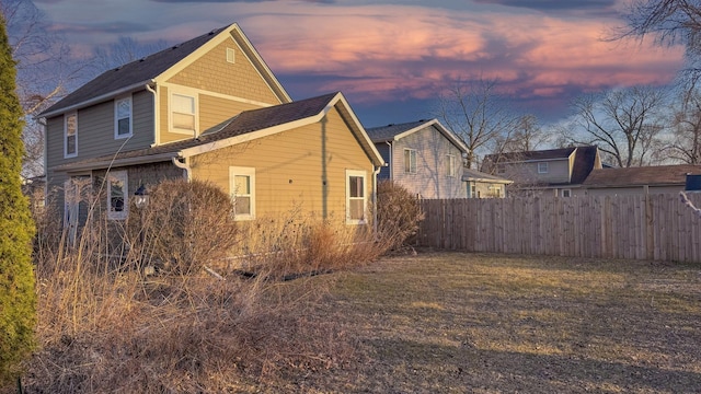 view of property exterior featuring fence