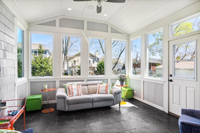 sunroom with a ceiling fan and lofted ceiling