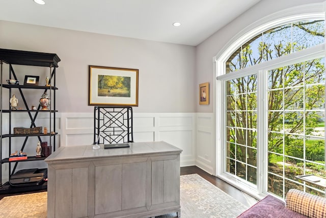 office area with a decorative wall, recessed lighting, dark wood-style flooring, and wainscoting