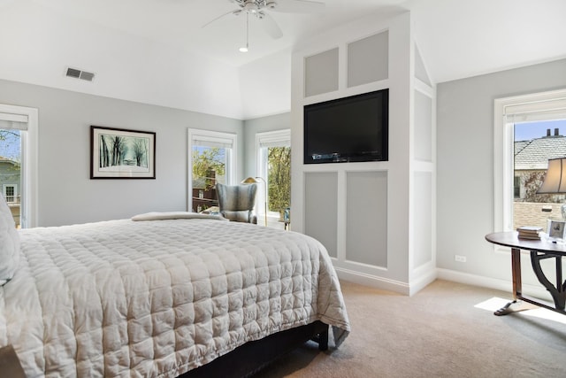 bedroom featuring baseboards, visible vents, light carpet, and lofted ceiling