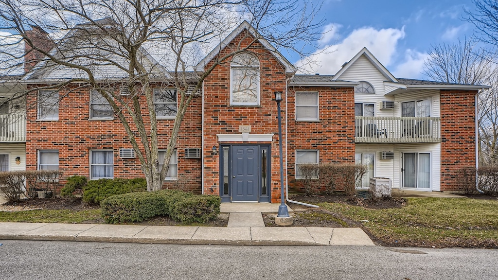 multi unit property featuring brick siding