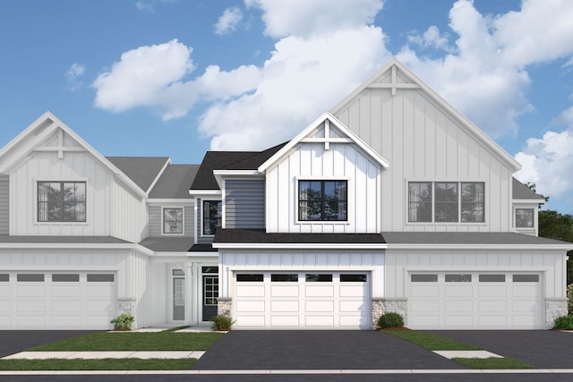 view of front of home with board and batten siding and driveway