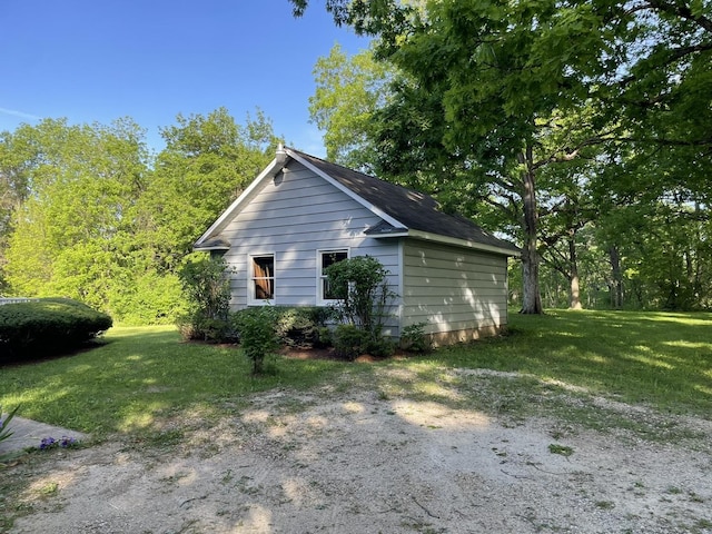 view of side of property with a yard