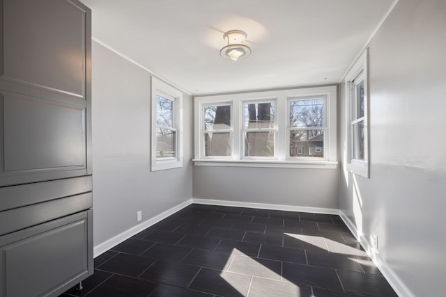 interior space featuring a wealth of natural light and baseboards