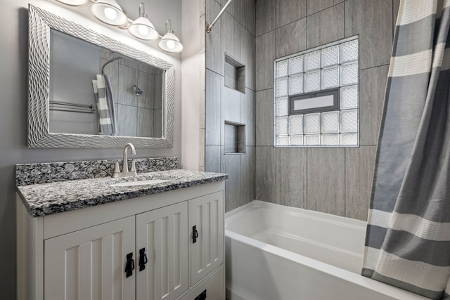 full bath with vanity and shower / bath combo