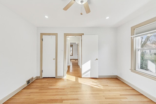 unfurnished room with visible vents, light wood-style flooring, recessed lighting, baseboards, and ceiling fan