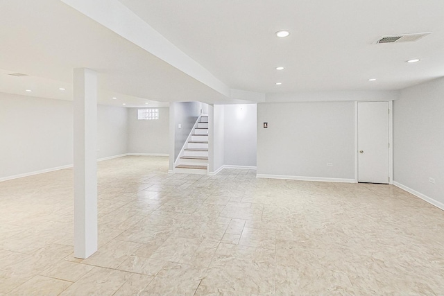 basement featuring recessed lighting, visible vents, baseboards, and stairs