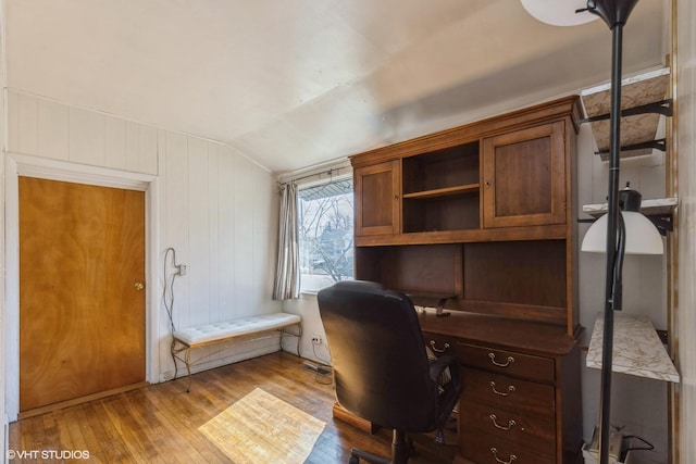 office with lofted ceiling and wood-type flooring