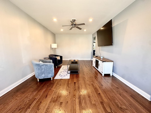 living area featuring dark wood finished floors, recessed lighting, a ceiling fan, and baseboards