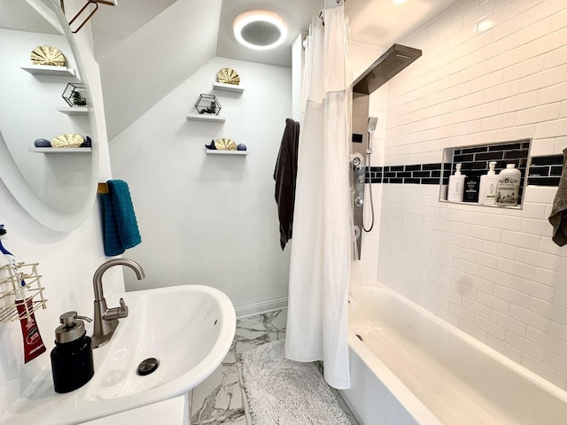 full bath with shower / bath combination with curtain, baseboards, marble finish floor, and a sink