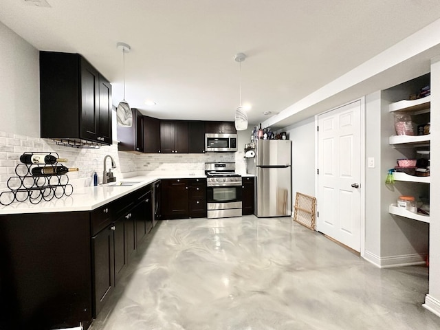 kitchen with a sink, finished concrete floors, stainless steel appliances, light countertops, and decorative backsplash