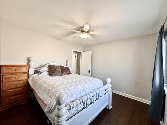 bedroom featuring ceiling fan, baseboards, and wood finished floors