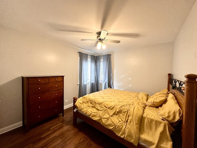 bedroom with baseboards, dark wood-type flooring, and ceiling fan