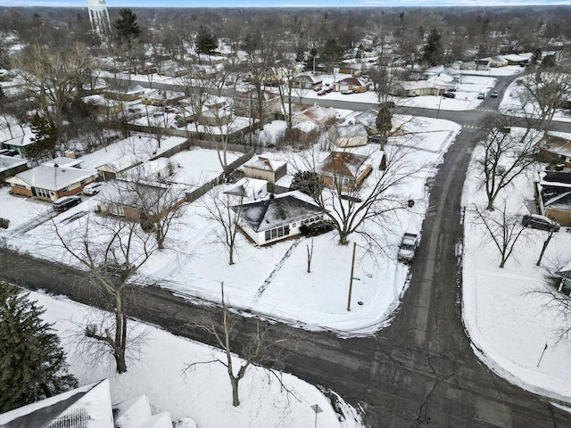 snowy aerial view featuring a residential view