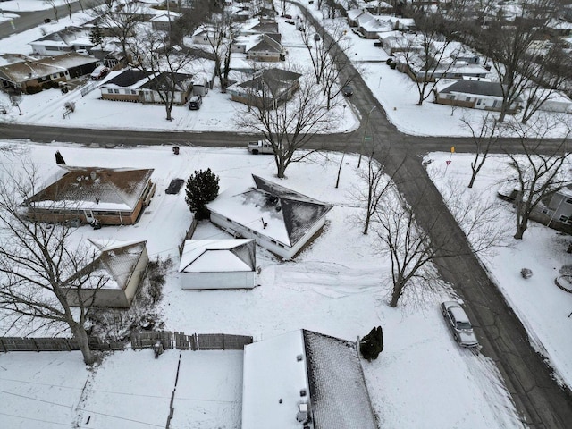 snowy aerial view with a residential view