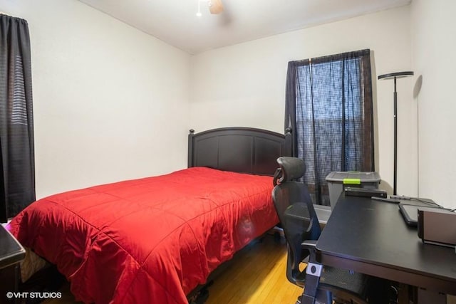 bedroom with wood finished floors