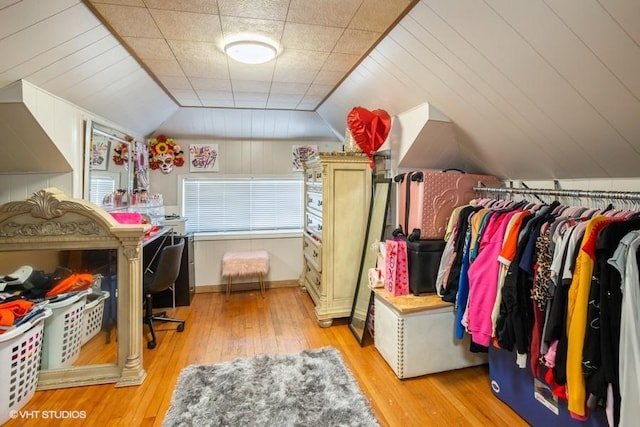 spacious closet with lofted ceiling and light wood-type flooring