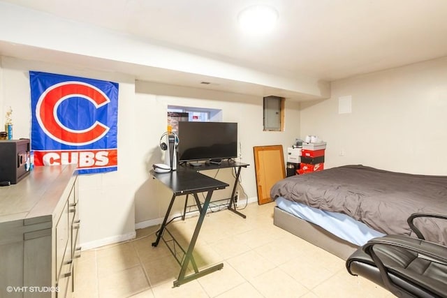 bedroom featuring electric panel, light tile patterned floors, and baseboards