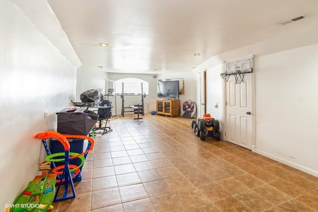 recreation room with tile patterned floors and visible vents