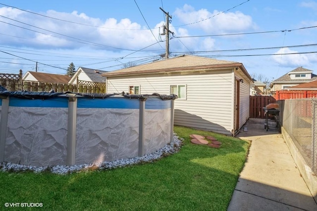 exterior space with a fenced in pool and a fenced backyard