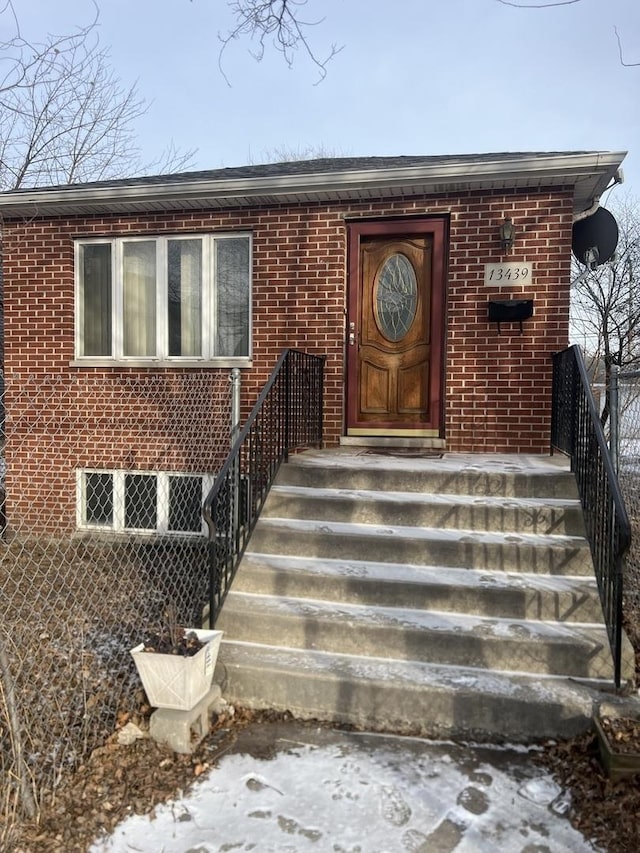 property entrance with brick siding