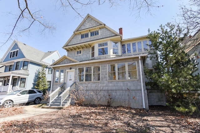 view of front of home featuring a chimney