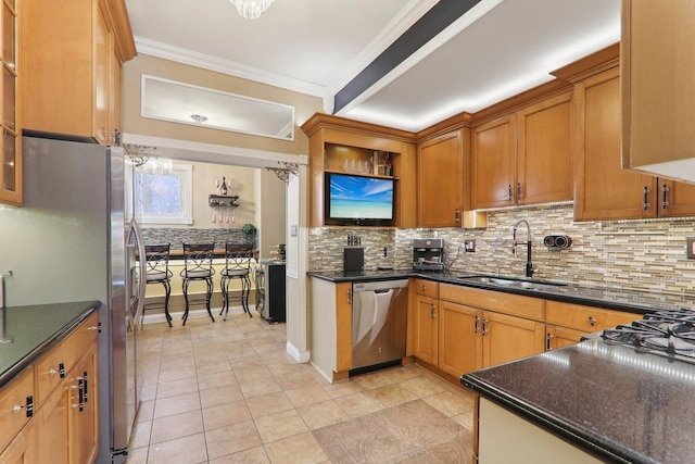 kitchen featuring ornamental molding, decorative backsplash, brown cabinets, appliances with stainless steel finishes, and a sink