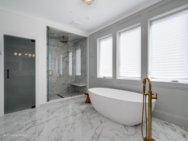 full bath featuring crown molding, marble finish floor, a marble finish shower, and a freestanding bath