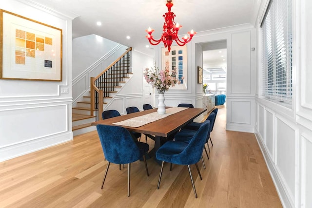 1741 N Rockwell St, Chicago, IL 60647 - dining space featuring stairs, a notable chandelier, a decorative wall, and a healthy amount of sunlight
