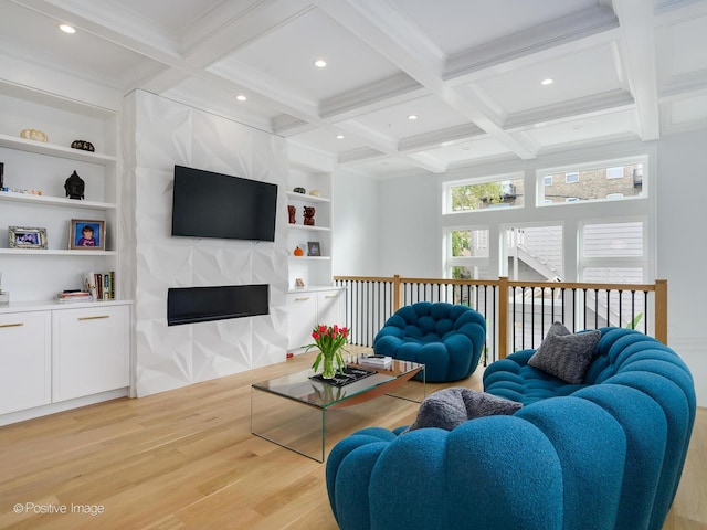 living area featuring beamed ceiling, coffered ceiling, and light wood-style floors