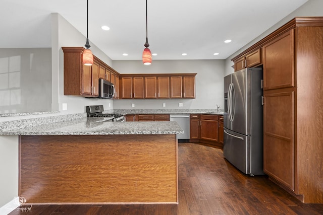 kitchen with recessed lighting, stainless steel appliances, a peninsula, light stone countertops, and dark wood-style flooring