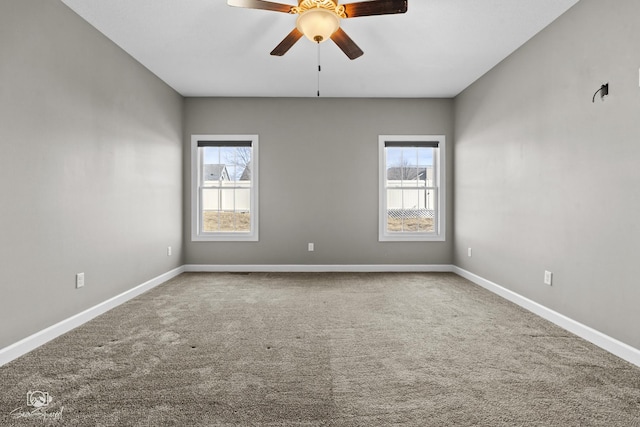 spare room featuring baseboards, carpet, and ceiling fan