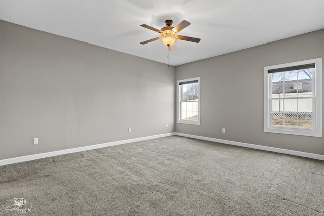 empty room featuring baseboards, carpet, and ceiling fan