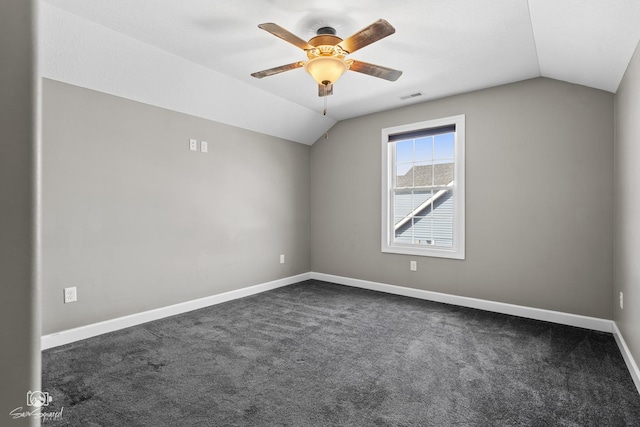 unfurnished room with vaulted ceiling, baseboards, visible vents, and ceiling fan