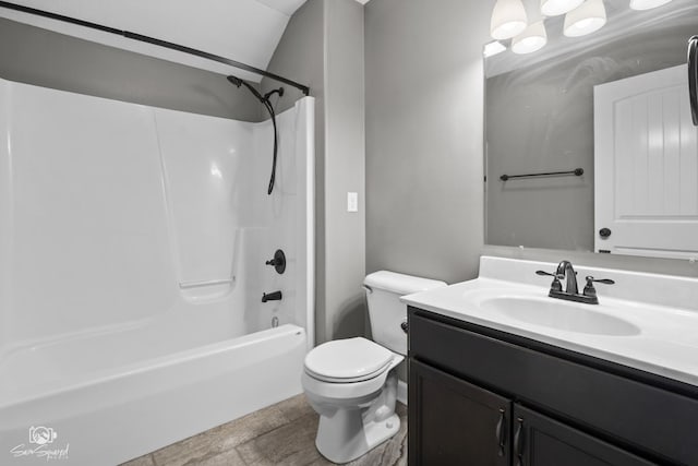 bathroom with toilet, vanity, and shower / bathing tub combination