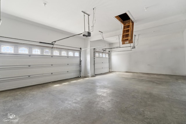 garage featuring a garage door opener