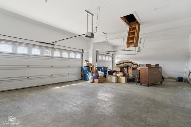 garage featuring a garage door opener